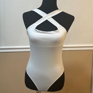 Charlotte Russe criss cross front white bodysuit top. Size small
